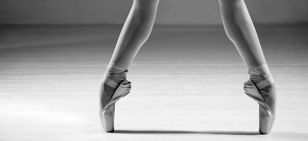 Pointe shoes on dark background Ulanova ballet shoes Aesthetics