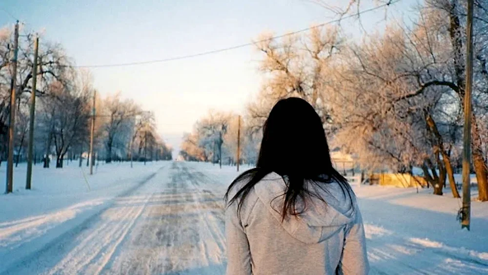 Girl in winter with back in winter