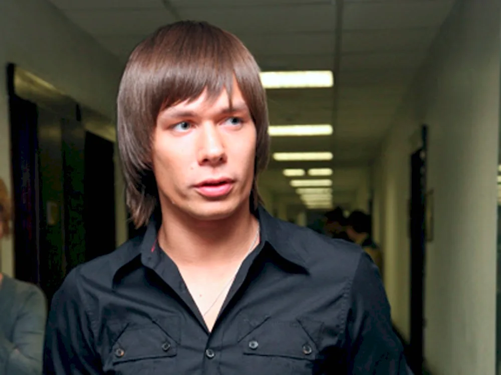 Stas Piekha with long hair