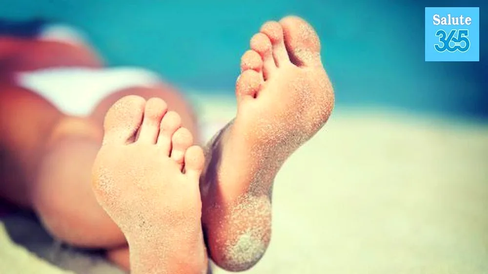 Girls' feet on the beach