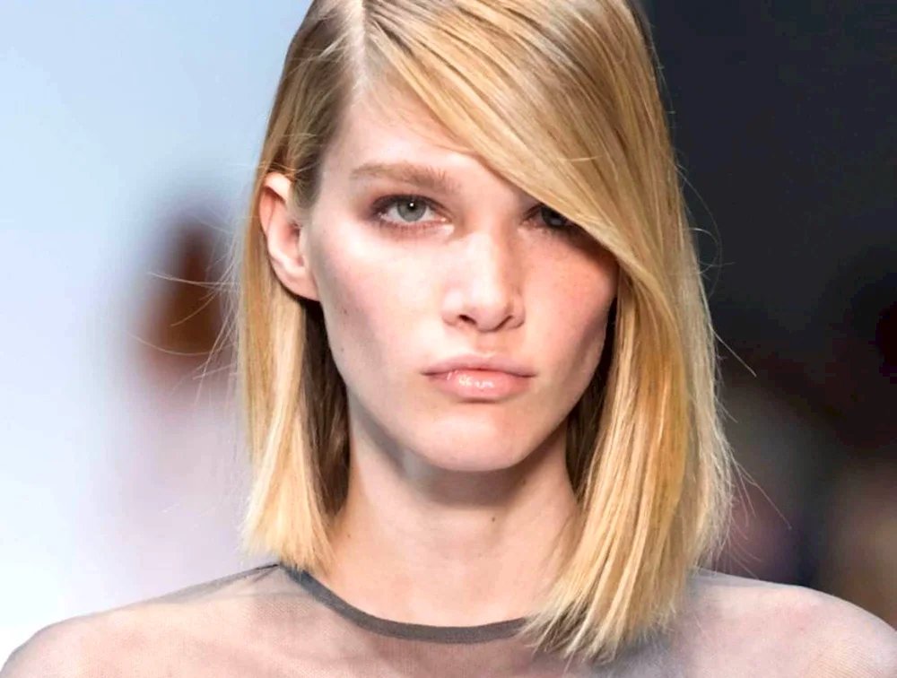 A haircut with an oblique parting