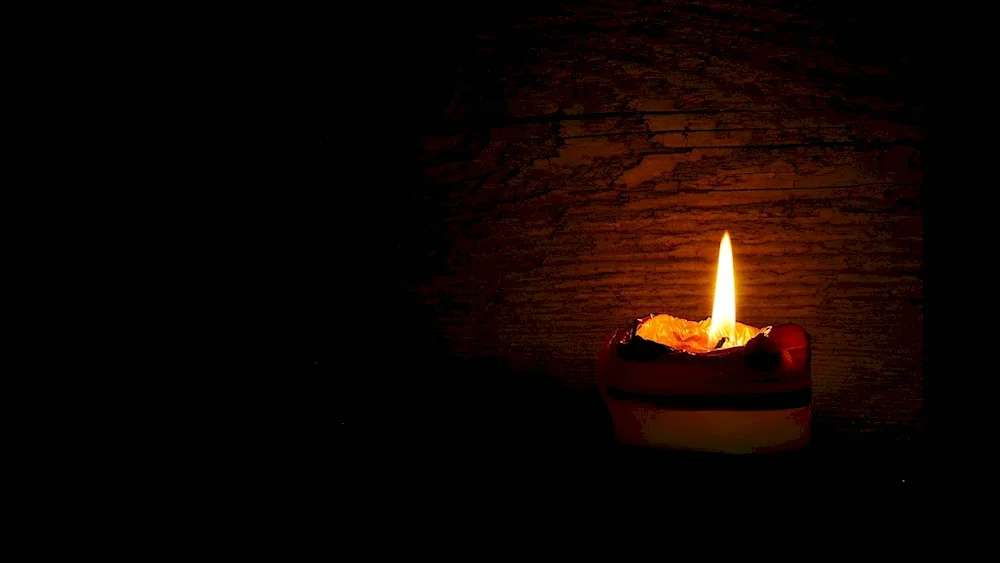 Candle on dark background