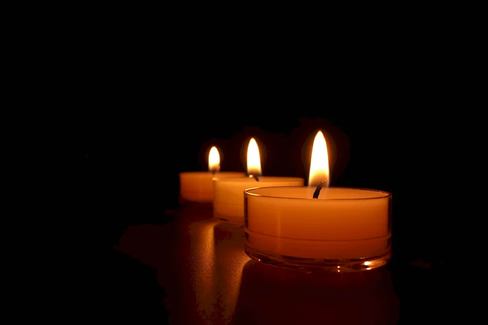 Candle on black background