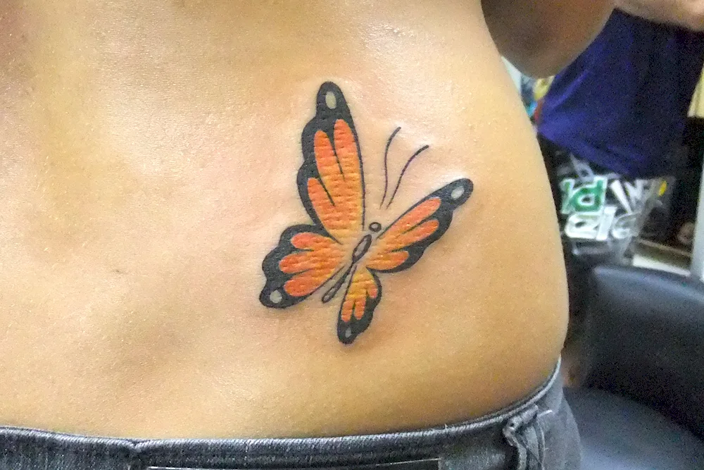 Tattoo butterfly on thigh