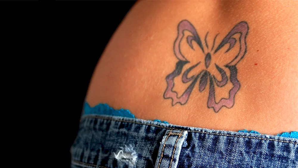 Tattoo butterfly on thigh