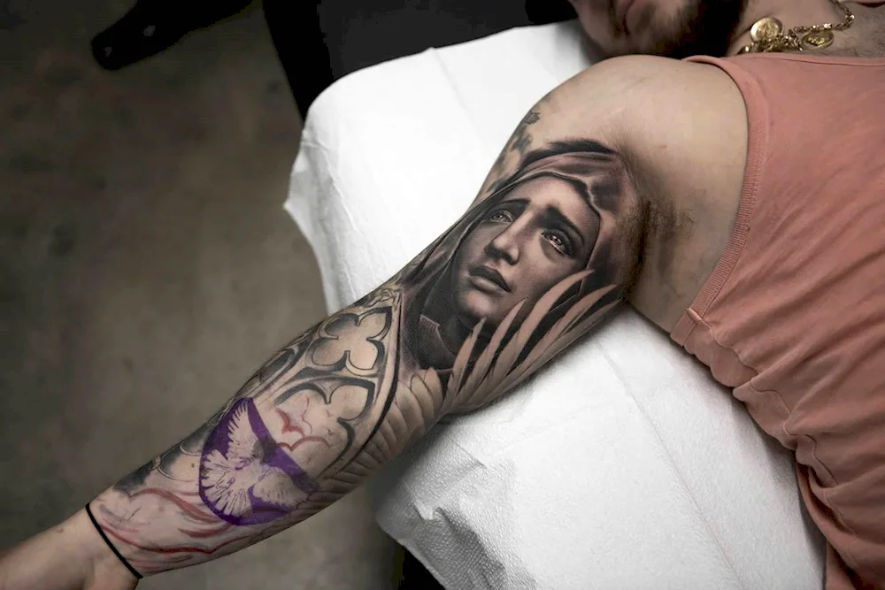 Chicano male religious tattoo