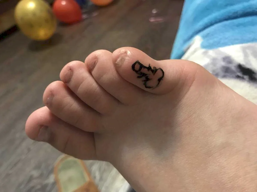 Baby foot tattoo