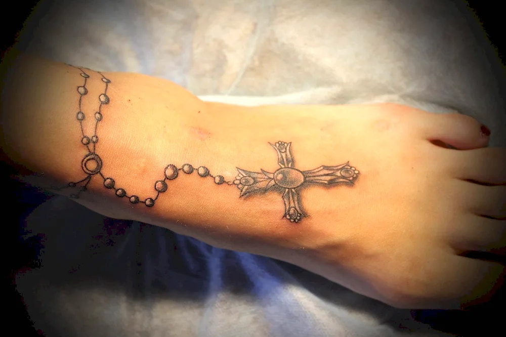 Tattoo cross with chain