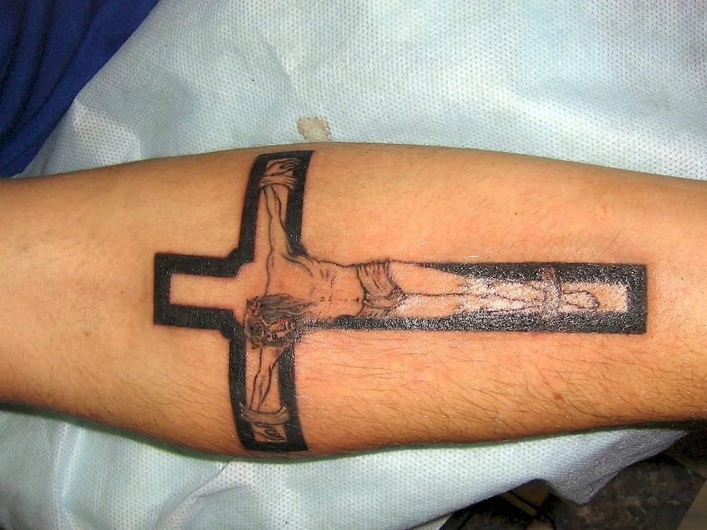 Tattoo cross on leg