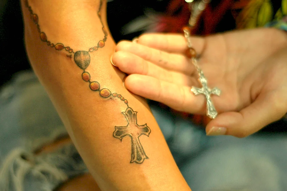 Tattoo cross on hand