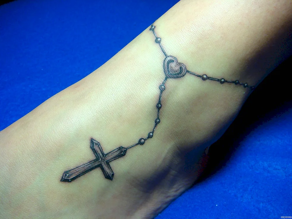 Tattoo cross with chain