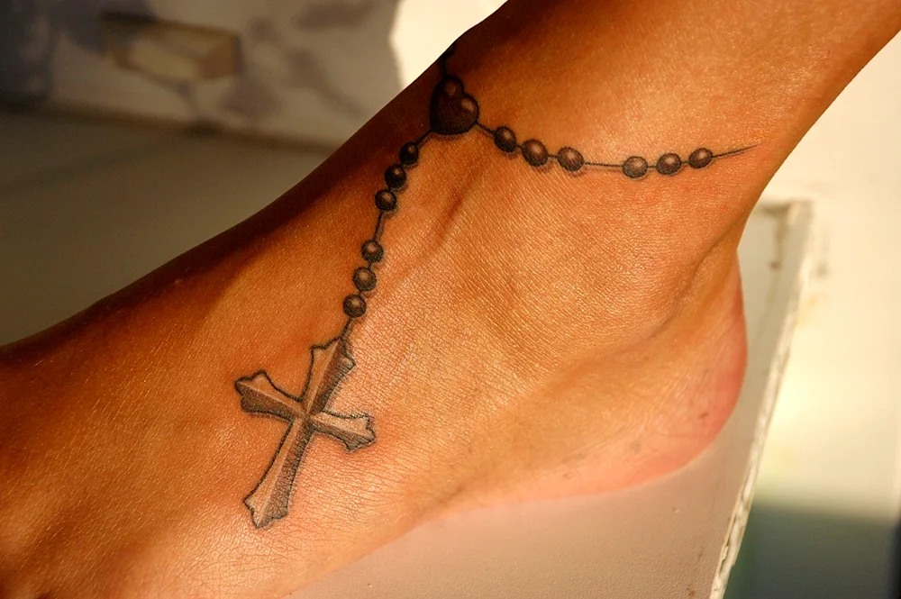 Tattoo cross with chain