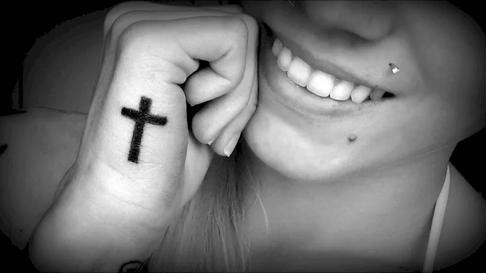 Tatu cross on wrist