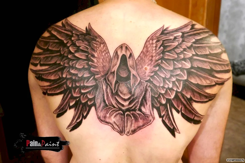 Wings tattoo on chest