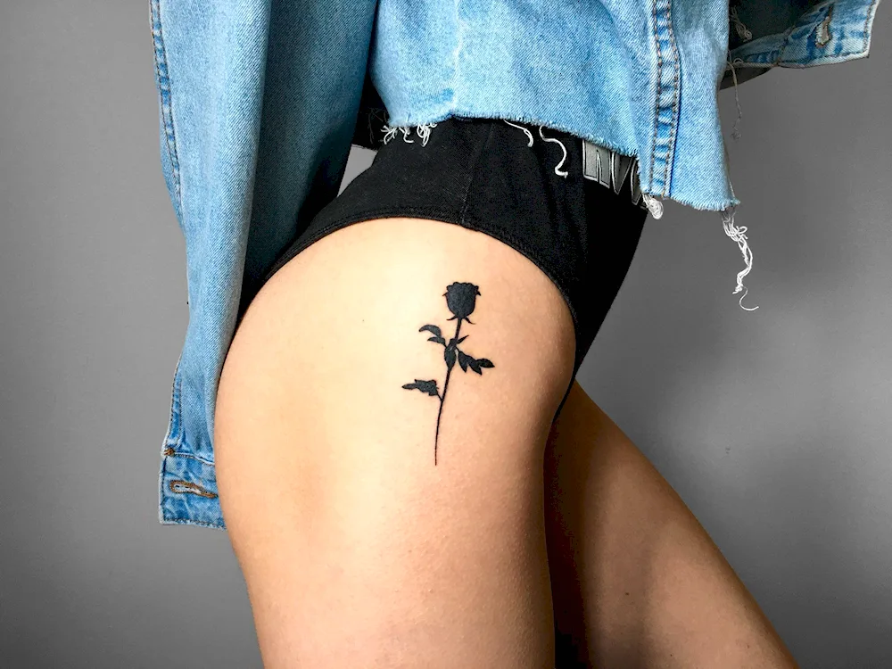 Thigh tattoo