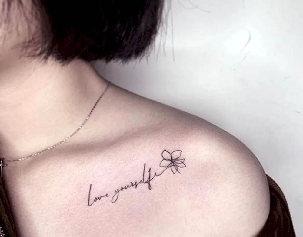 Clavicle tattoo