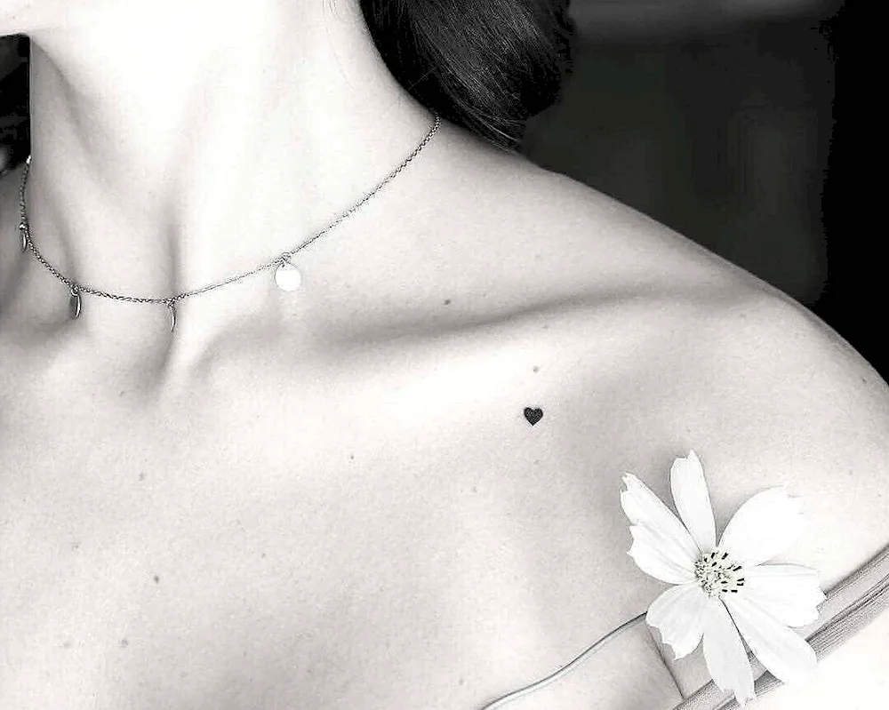 Heart tattoo on collarbone