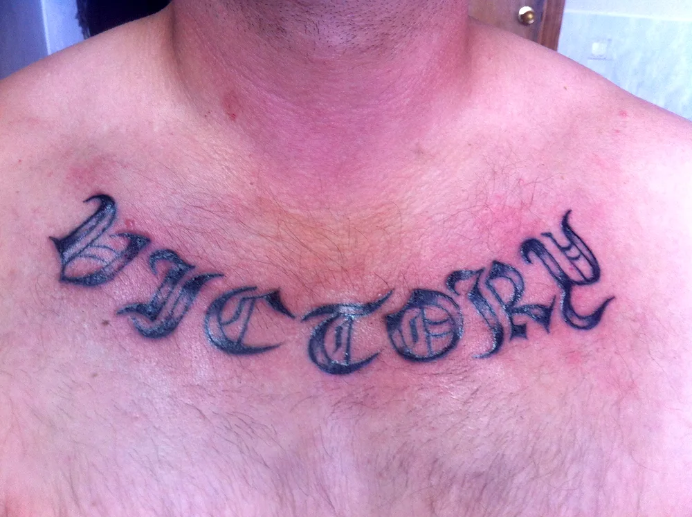 Men's collarbone tattoo