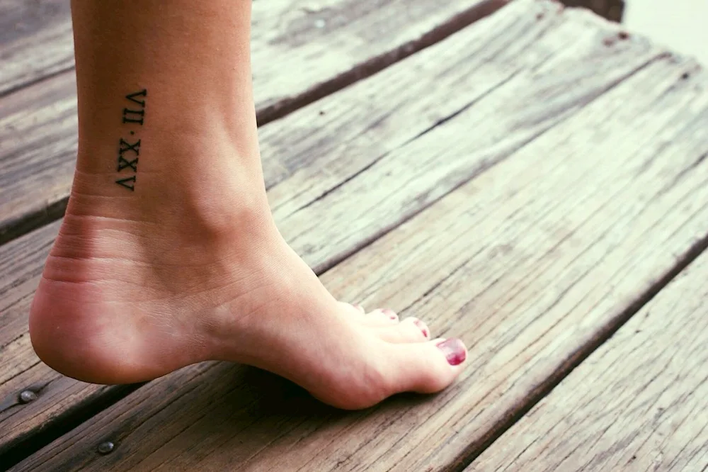 Tattoos on the foot.