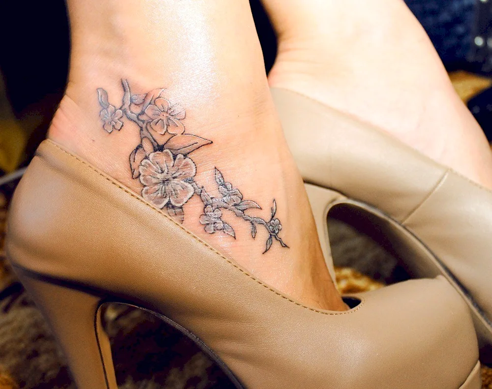 Foot tattoo in heels