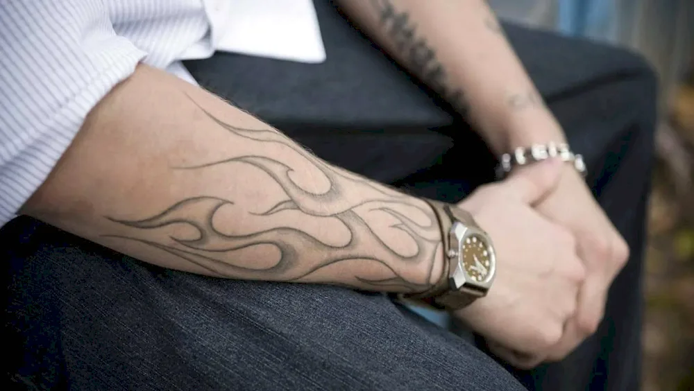 Men's arm tattoos on the arm