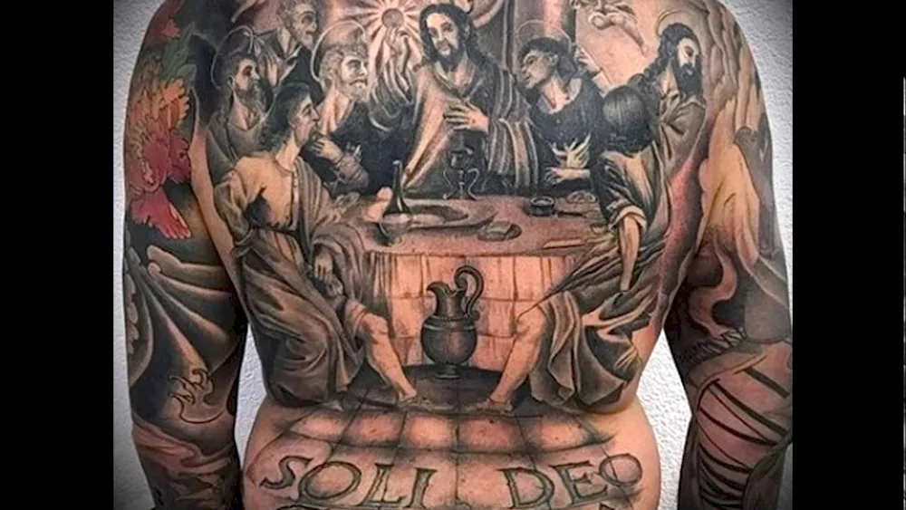 Tattoo on the back religious masculine