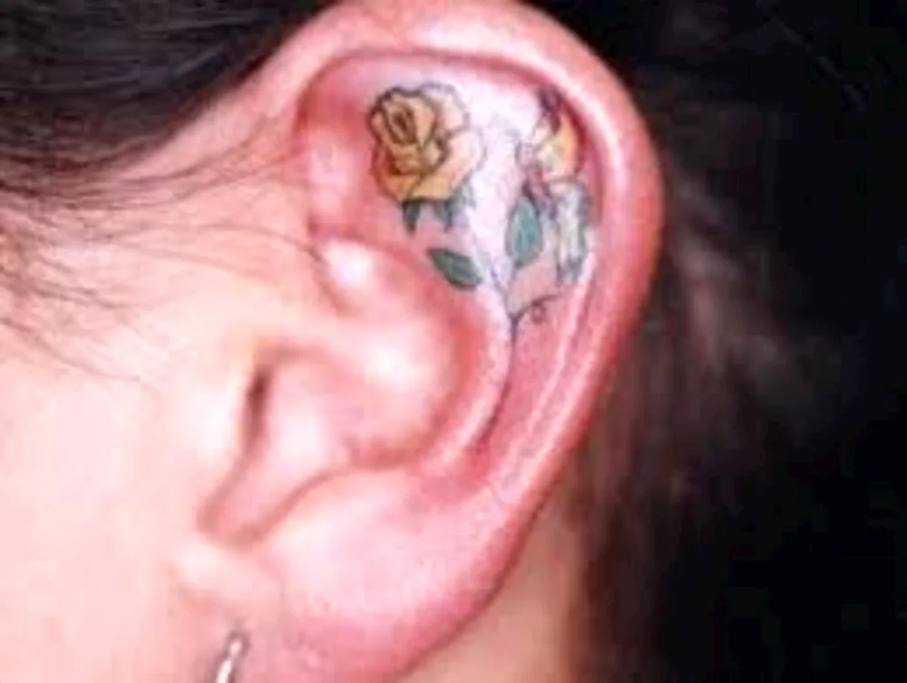 Girl ear tattoo