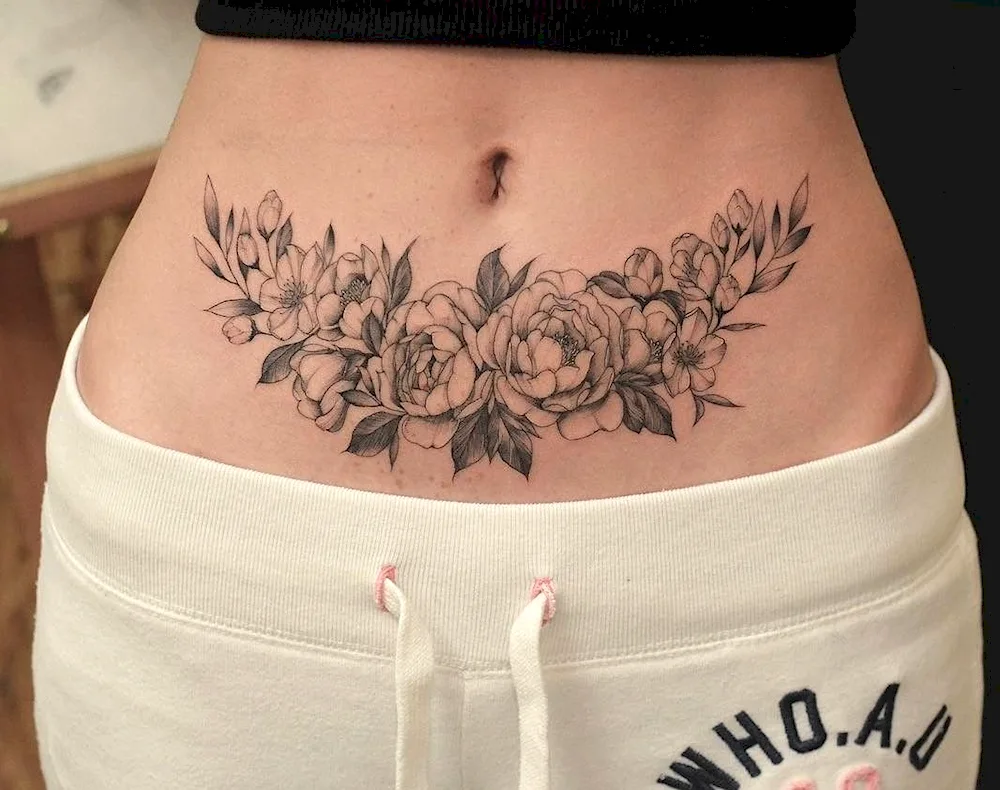 Tattoo on belly button belly