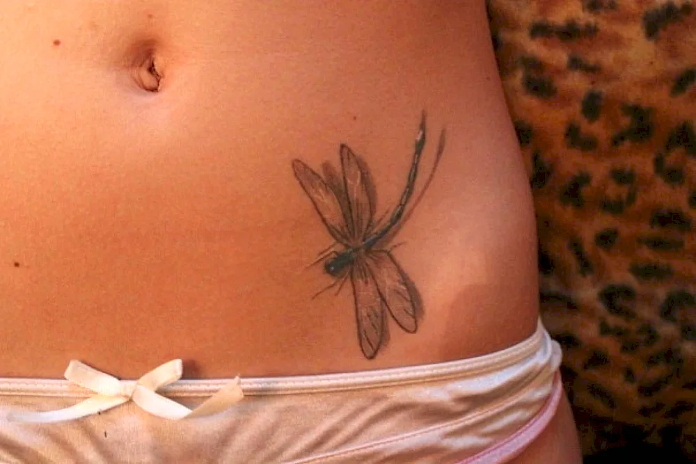 Tattoo on girl's lower back