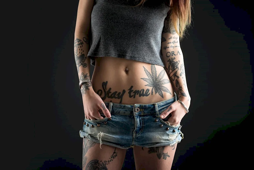 Tattoo on belly on a girl's lower back