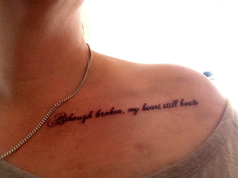 Tattoo inscriptions on collarbone