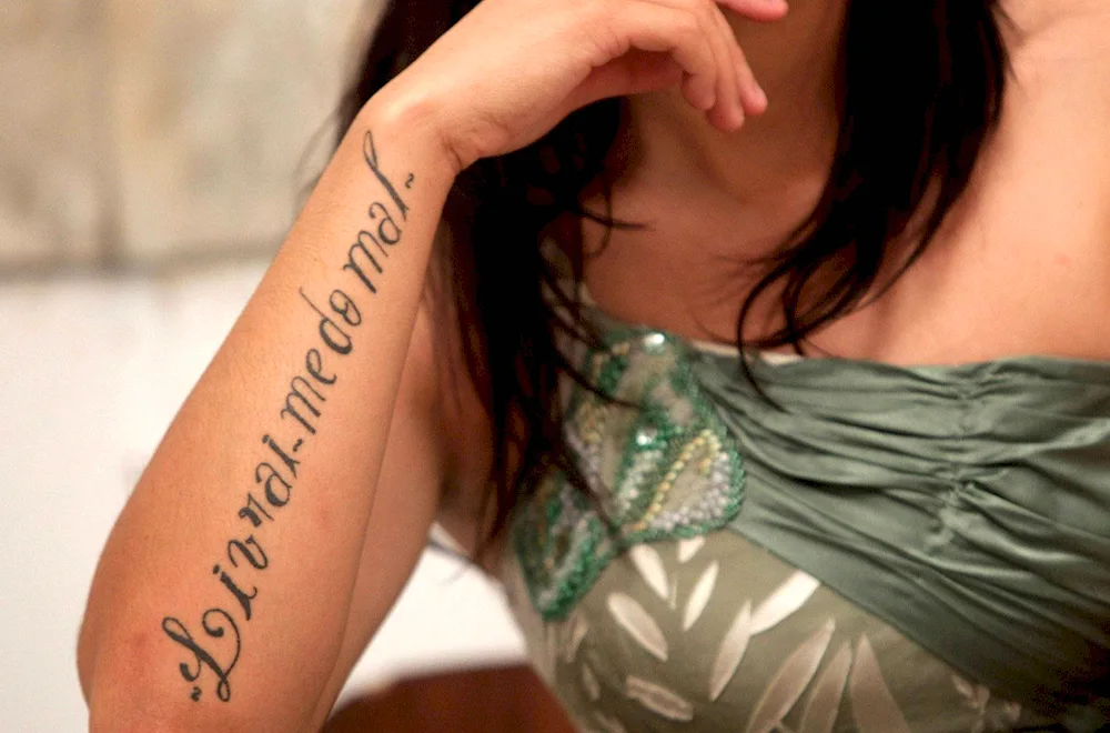 Tattoo lettering on arm