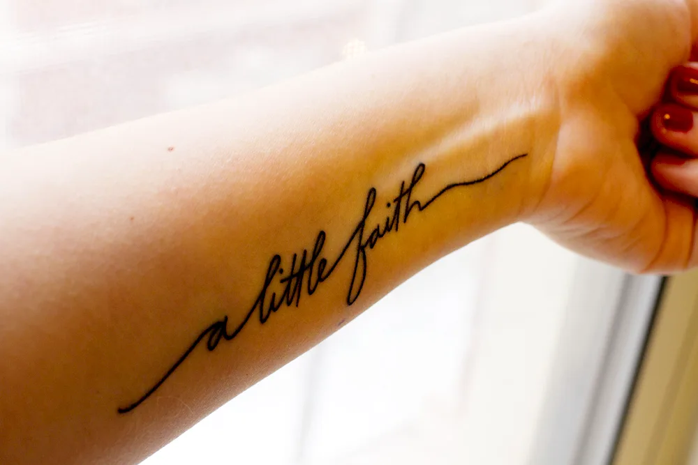 Tattoo lettering on arm