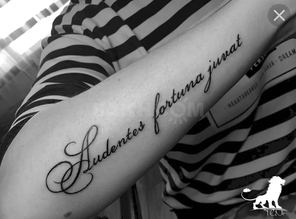 Tattoo lettering on leg