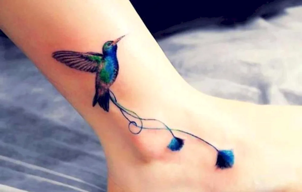 Swallow tattoo on the arm for girls