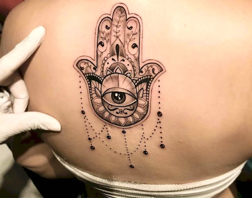 Ornamental evil eye tattoo