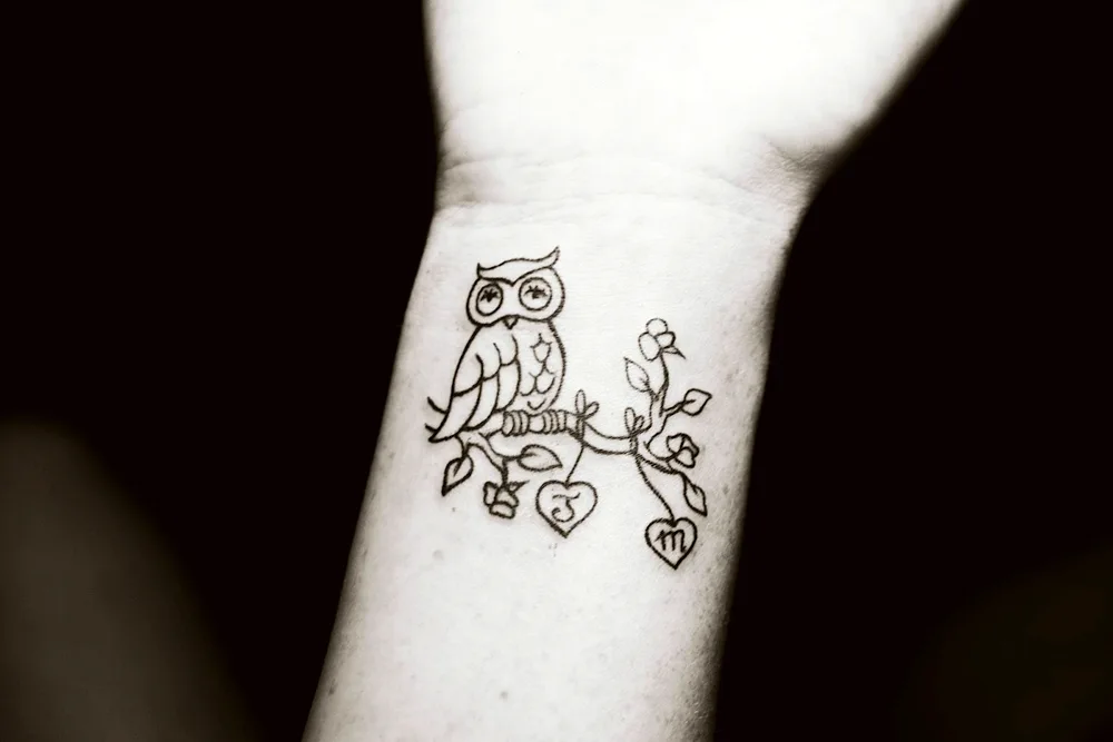 Tattoo Owl on wrist