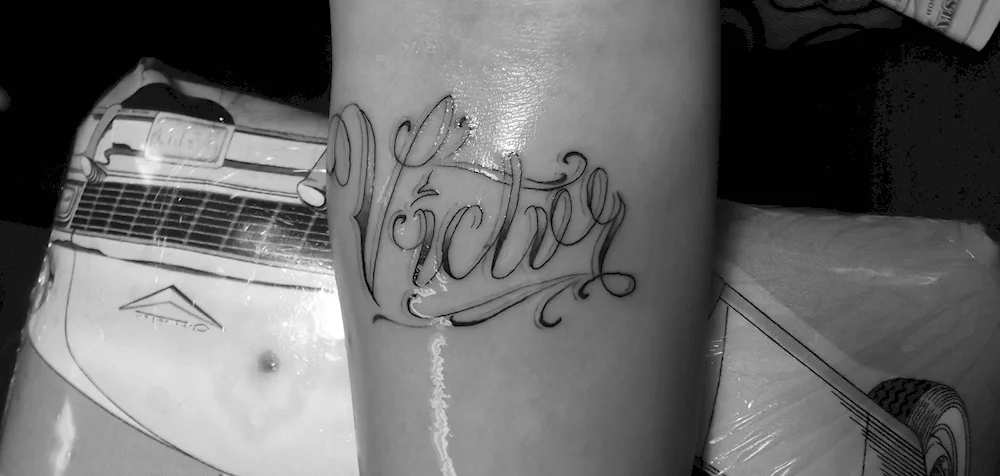 Victor tattoo lettering