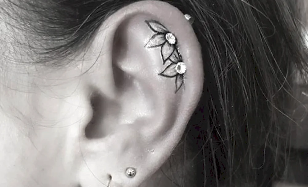 Scorpion ear tattoo