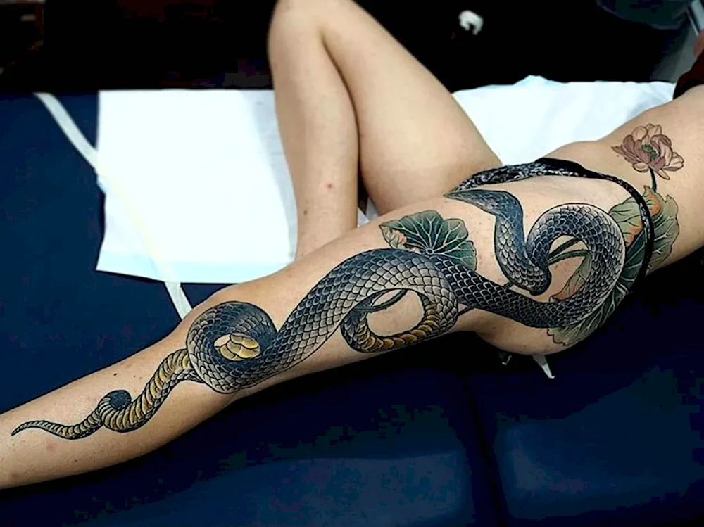 Dragon tattoo on thigh