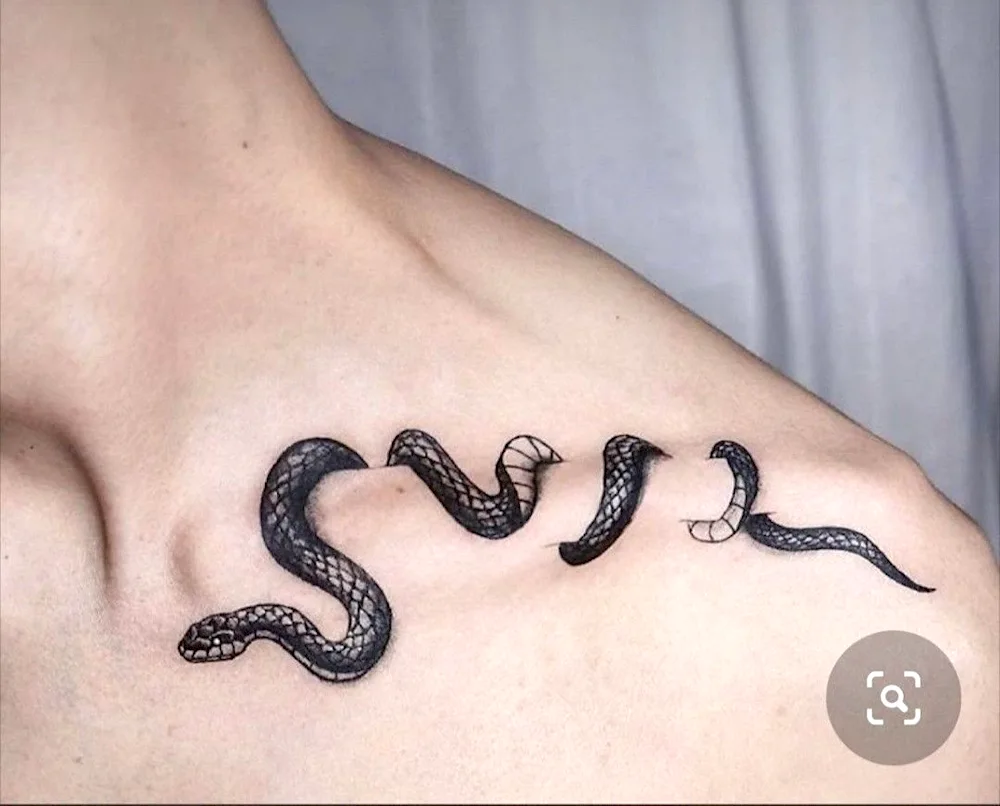 Snake tattoo on collarbone