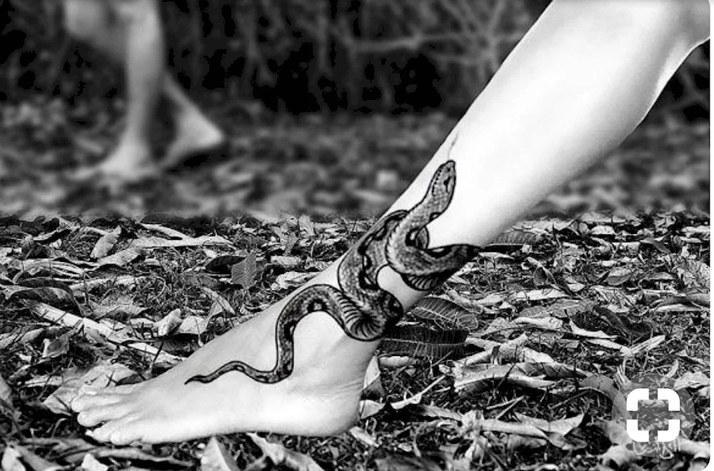 Snake tattoo on leg