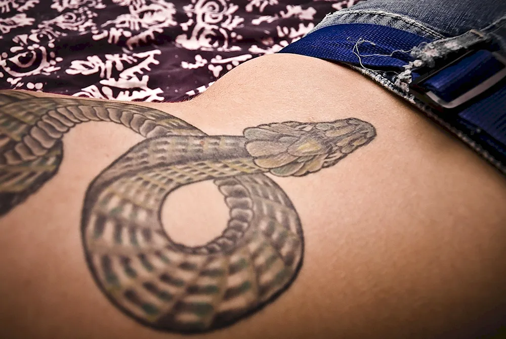 Snake tattoo on leg