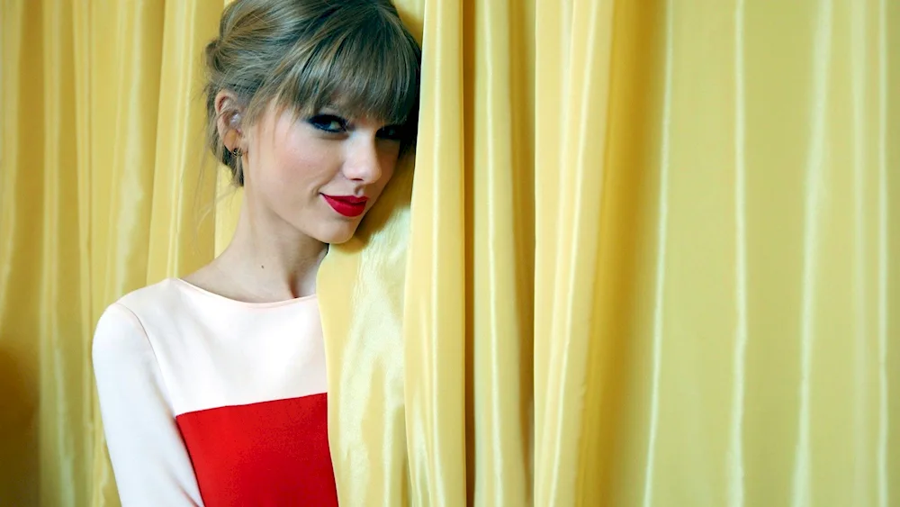 Girl hanging curtains