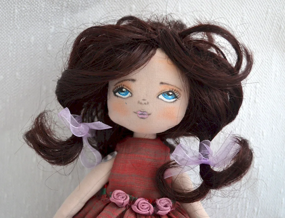 Textile dolls in burgundy colour