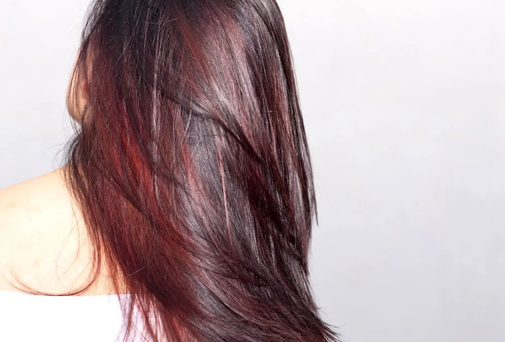 Dark hair with red highlights