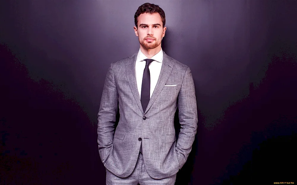 Theo James in a suit