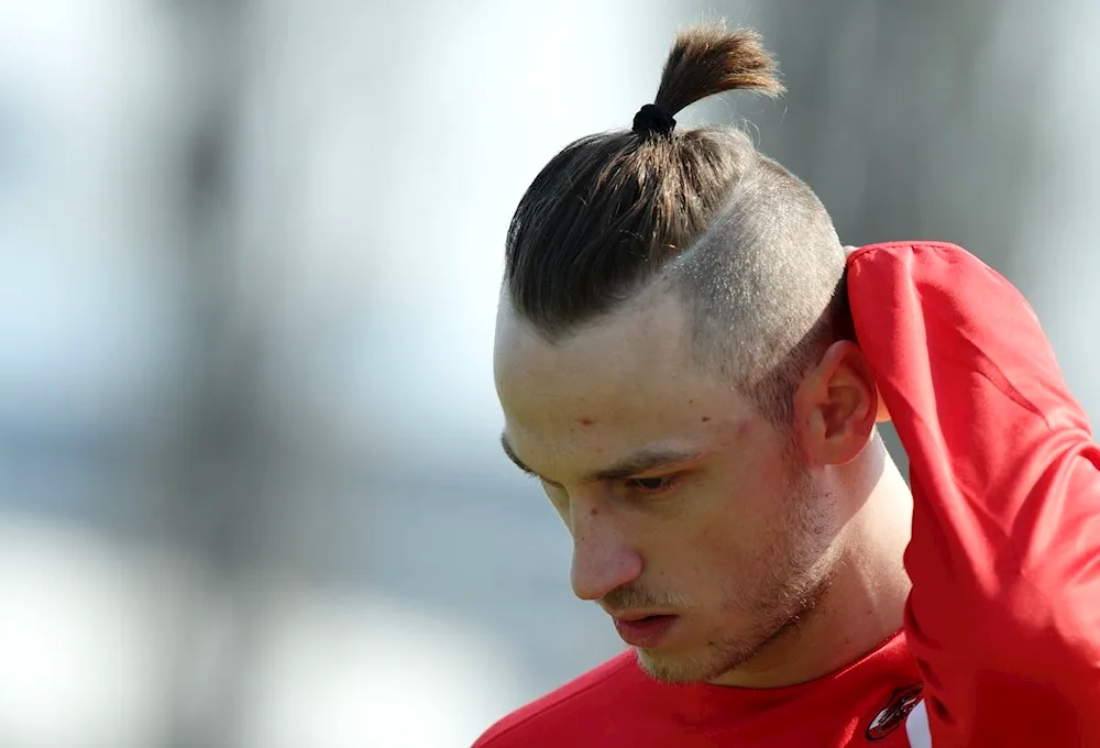 Beckham topknot haircut
