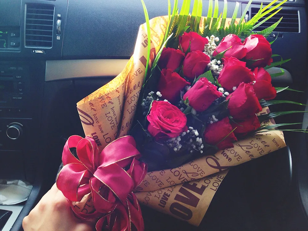 A bouquet of roses in the car