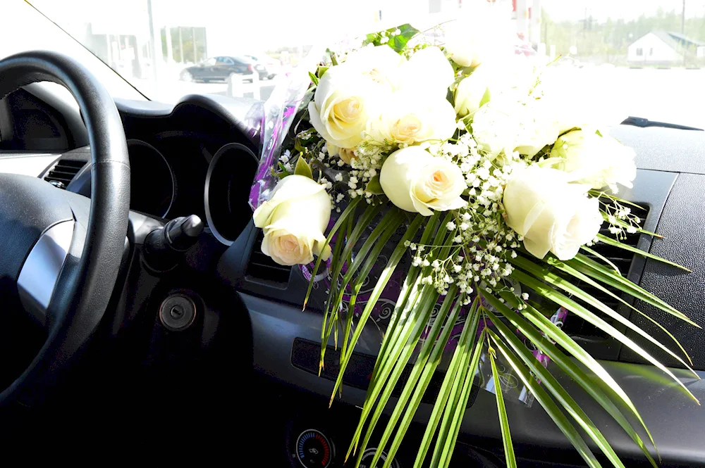 A bouquet of flowers in the car